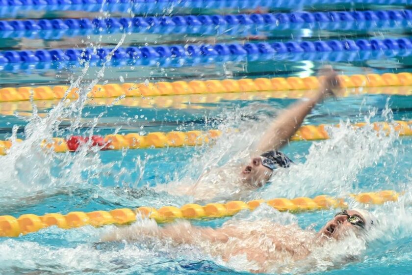Masters swimmer swimming backstroke