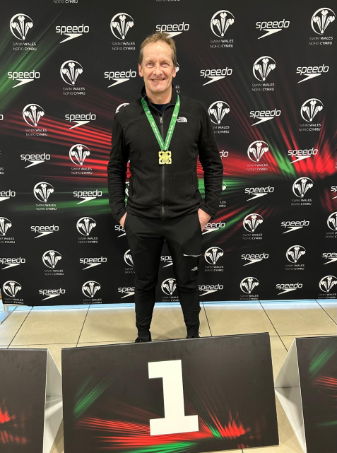 Spencer Swimmer winning a gold medal